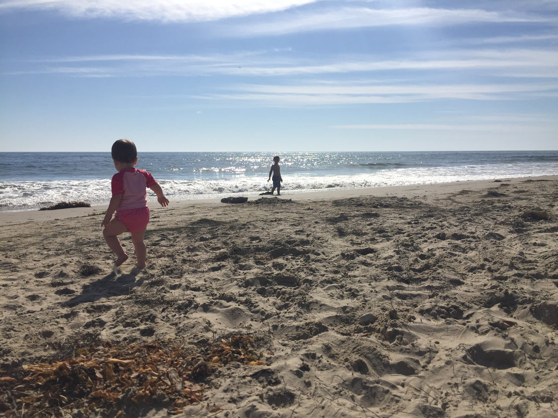 kids playing on beach and in ocean in santa barbara